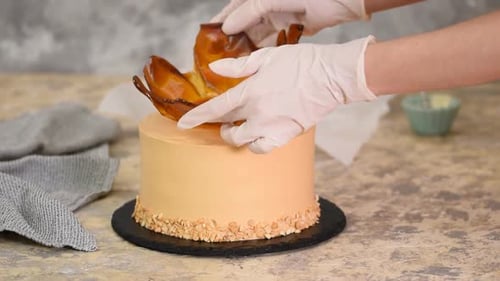 Baker Decorates Caramel Cake