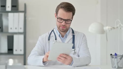 Doctor Using Tablet in Bright Office Environment