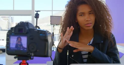 Model recording her video in photo studio 4k