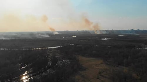 Aerial View of the Burning Fields Near the City. Burning Fields in the Spring Near the City.