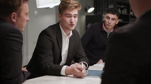 A company of office employees brainstorm together with the CEO of the company. creative process