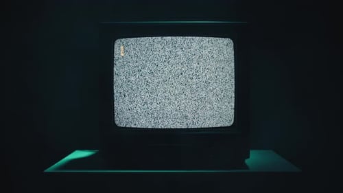 Vintage Television Displaying Static in Dark, Teal Room