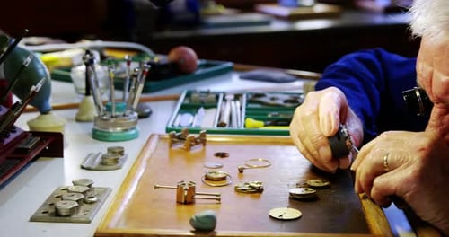 Horologist repairing a watch