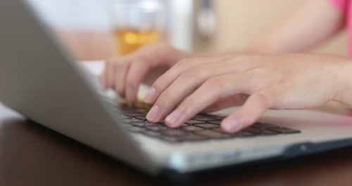 Woman work on laptop computer at home