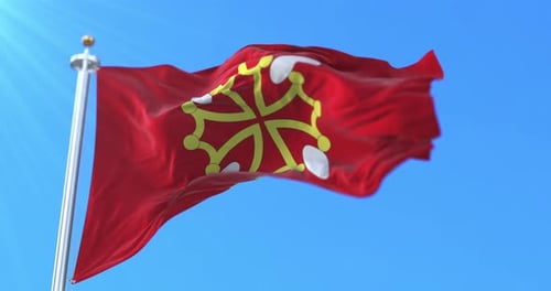 Flag of Occitania Waving Against a Clear Blue Sky
