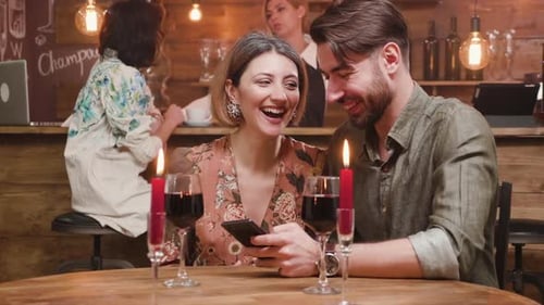 Affectionate Couple Enjoying Evening Date Night at Bar