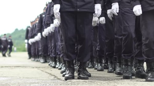 Uniformed Group Standing in Formation Outdoors