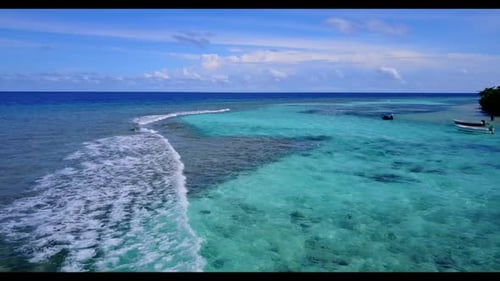 Aerial travel of tropical island beach break by blue ocean and white sand background of a dayout nea