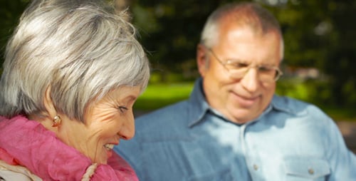 Senior Couple Conversing and Smiling in the Park