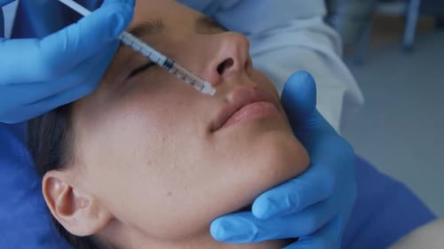 Lip Injection Treatment for Beautiful Woman in Clinic