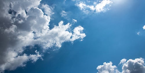 Clouds Moving Across a Sunny Blue Sky