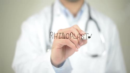 Doctor Writes Rhinoplasty on Transparent Surface
