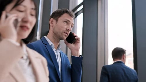 Business Man Talking on Phone in Modern Office