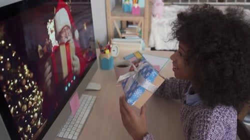 Child Video Chatting with Santa Showing Christmas Gift