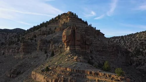 Aerial view rotating around rocky ridge in the Utah desert