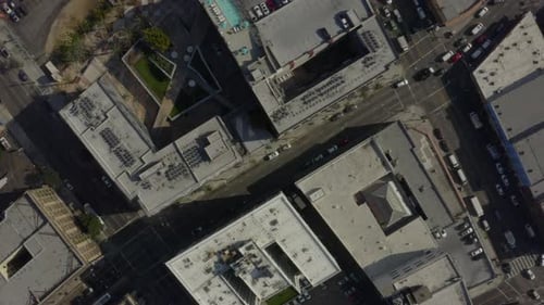 AERIAL: Birds Eye View Over Streets of Downtown Los Angeles, California with cars,Traffic and