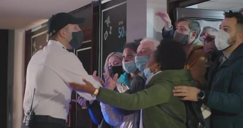 Crowd Asking Guard To Let People in Mall