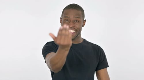 Man Gestures Come Hither on White Background