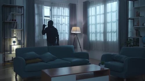 Masked Burglar Breaking Into House at Night