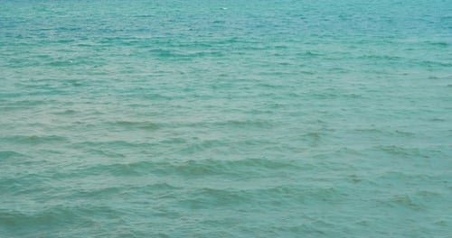 Beautiful View of the Sea with Small, Gentle Waves. Summer Day with Breeze and Bright Sun