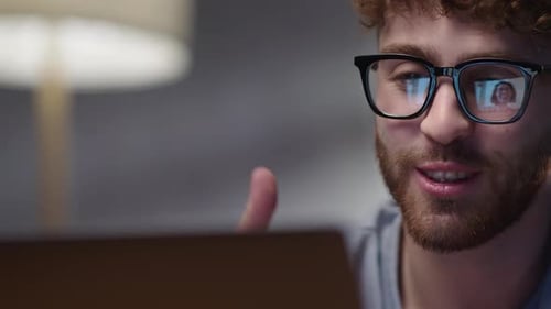 Young Adult Talking on Laptop Close Up