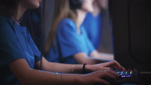 Group of Friends Sitting in the Gaming Club By Computers Beautiful Brunette Woman on the Foreground