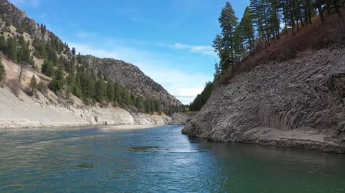 Flying over the Snake River in Jackson Canyon on sunny day