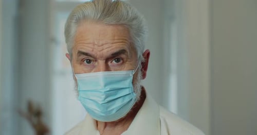 Senior Man Wearing a Medical Mask