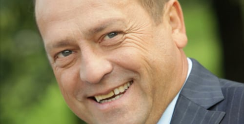 Smiling Man Wearing Suit Jacket Close Up