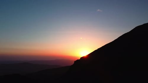 Aerial view of colorful sunrise on top of Carpathian Mountains range