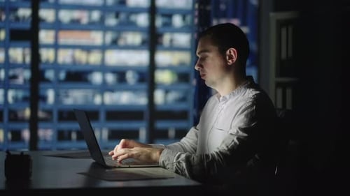 Businessman Returning to Office Opening Laptop Lid and Continue in Evening Work