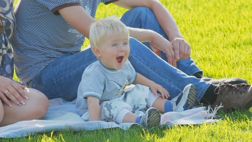 Happy Family on a Walk in the City Park