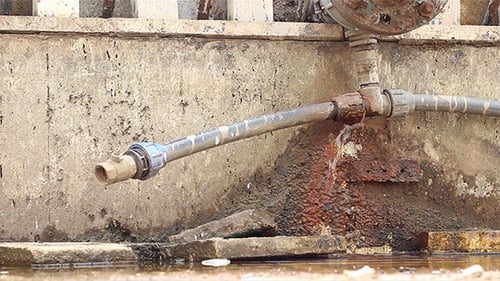 Leaking Pipe Shows Rust and Urban Decay