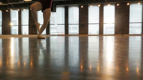 Dancer Practicing Ballet in Sunny Studio