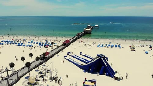 Large Sandy Beach of the Atlantic Ocean and People Relaxing on the Beach on a Sunny Day