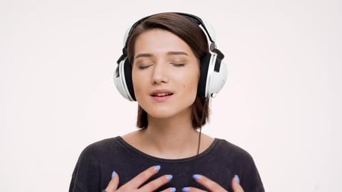 Woman Enjoying Music with Over-Ear Headphones