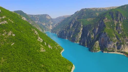 Aerial view on turquoise water in a mountain lake