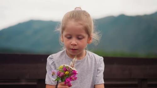 Girl with Allergy Looks at Windflowers Sneezing Near Fence
