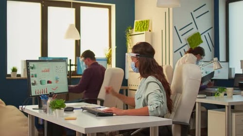 Office Workers Collaborating with Personal Protective Equipment
