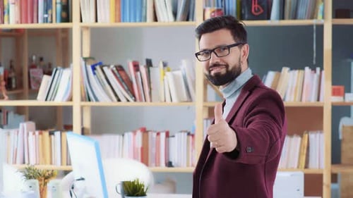 Man Gives Thumbs Up in Office Setting