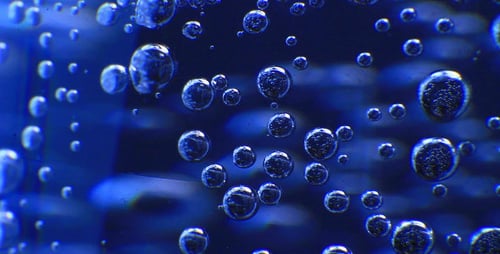 Macro Footage of Bubbles Moving in Blue Liquid