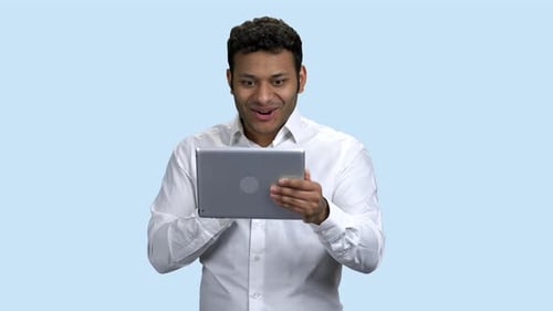 Excited Man Reacts to Tablet