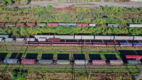 Colorful Train Cars Stationary Aerial View