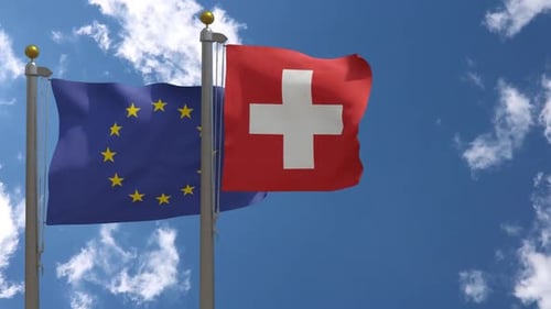 European Union Flag Vs Switzerland Flag On Flagpole