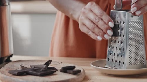 Unrecognizable Woman Grating Dark Chocolate