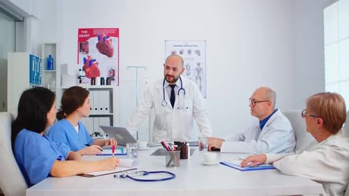 Medical Team Meeting in Bright Clinic Office