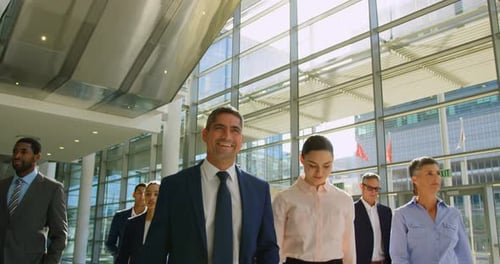 Multi ethnic business people walking together in the lobby at office 4k