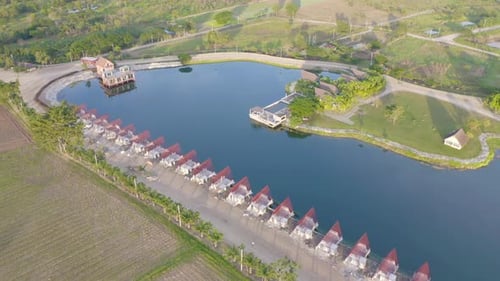 Aerial view of home, house or resort under contruction with lake or river with reflection