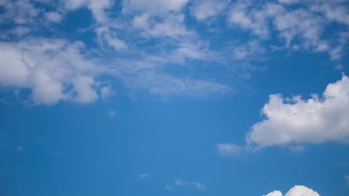 White Clouds Drifting Slowly Across a Blue Sky