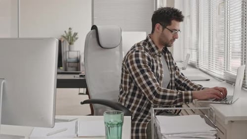 Programmer Working Alone in Office